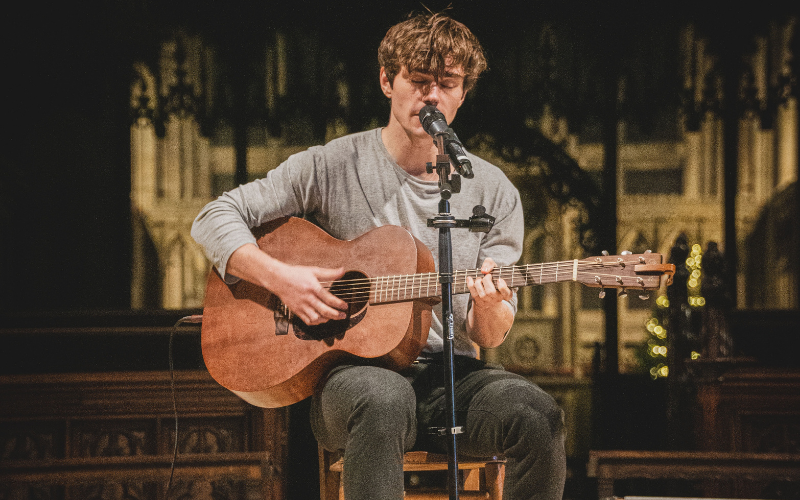 man on stage singing vibrato