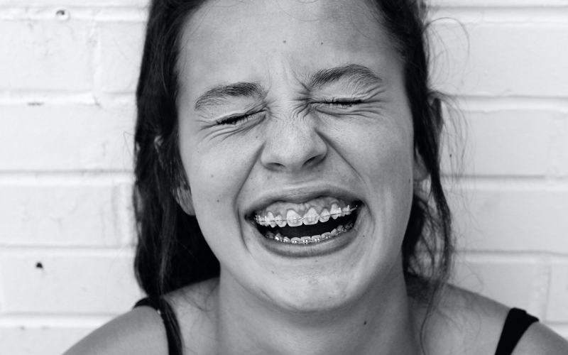 girl with braces laughing